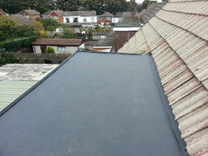 Laying out rubber on roof dormer