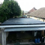 Completed roofing work on a garage