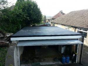 Completed roofing work on a garage